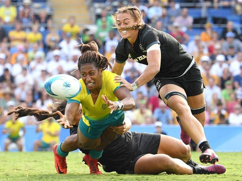 Ellia Green passes before hitting the deck in Australia's sevens final loss to New Zealand.
