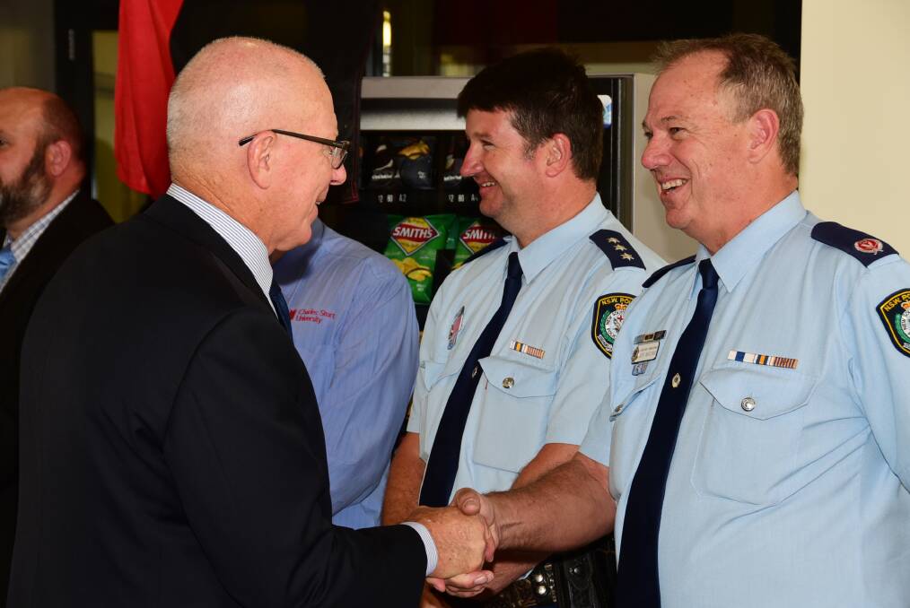 NSW Governor David Hurley is greeted by NSW Police Assistant Commissioner Geoff McKechnie and Orana Local Area Command Inspector Scott Tanner (centre).  
Photo: BROOK KELLEHEAR-SMITH