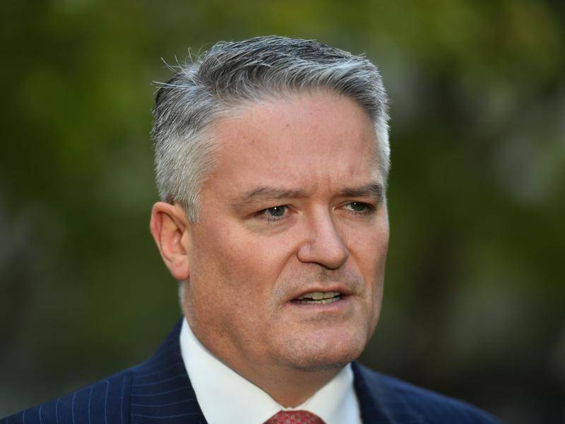Mathias Cormann says the coronavirus is spreading faster in other parts of the world.