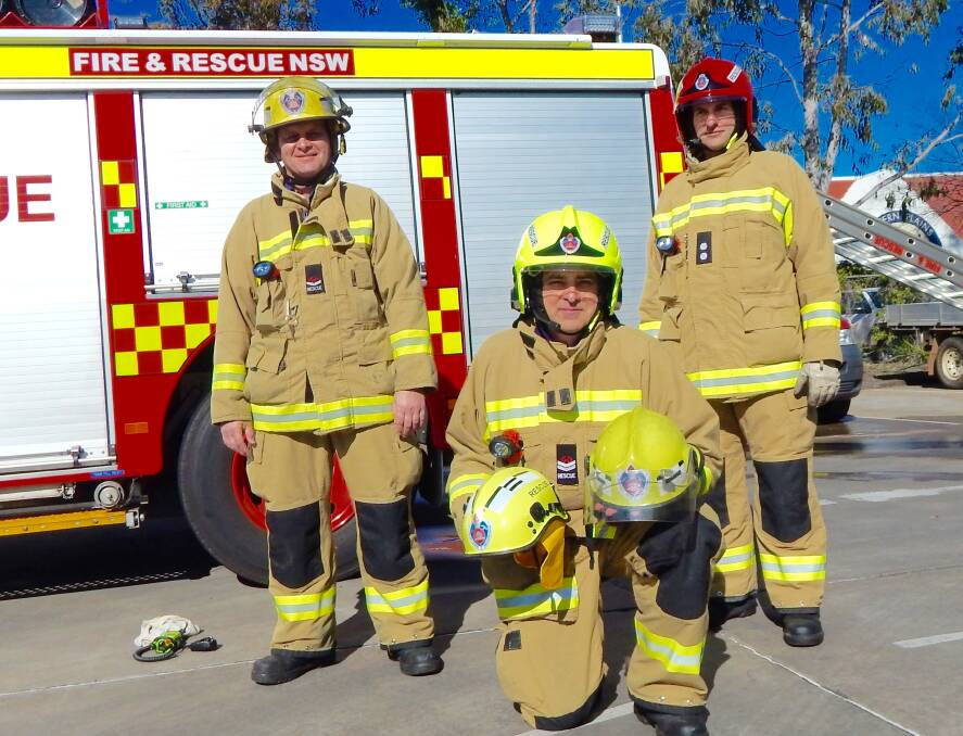 Fire and Rescue NSW firefighter Charles Antonievich wears one of the traditional helmets, while Greg Croake (centre) and station officer John Poulos (right) sport the new jet style helmets. 								         Photo: ANGELA CLUTTERBUCK