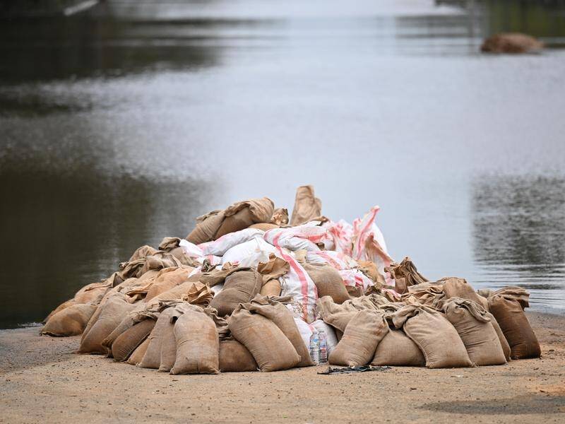 Sandbags provided little help in holding back the massive deluge which hit the NSW town of Molong. (James Ross/AAP PHOTOS)