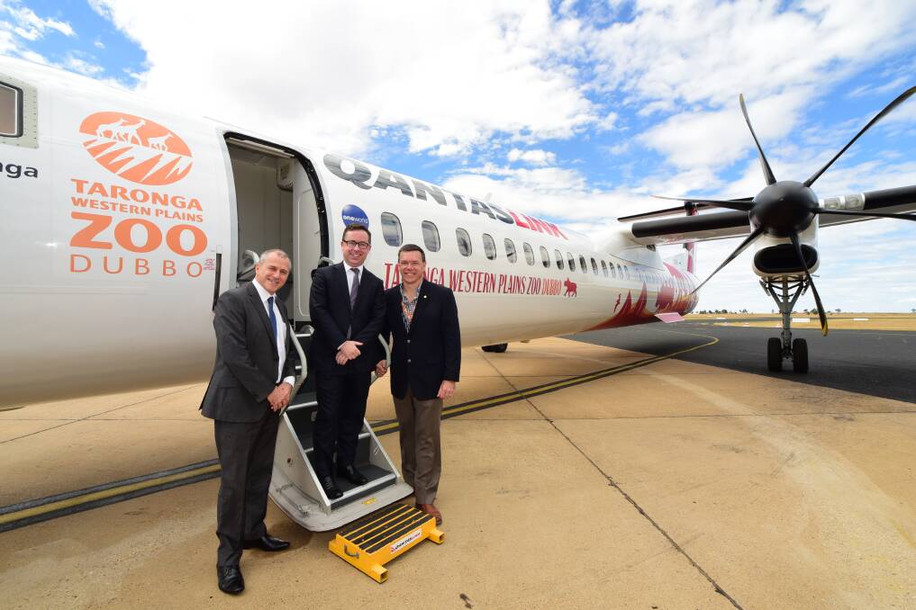 QantasLink CEO John Gissing, Qantas CEO Alan Joyce and Taronga Western Plains General Manager Matt Fuller with the new look Q400. 
Photo: BELINDA SOOLE