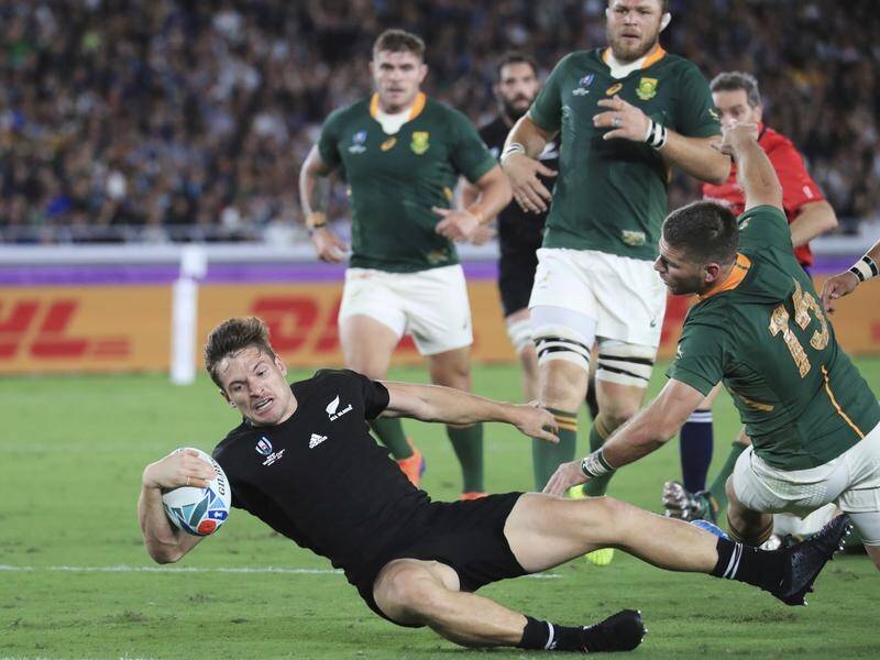 The two-time defending champion All Blacks have beaten South Africa 23-13 in their opening game.