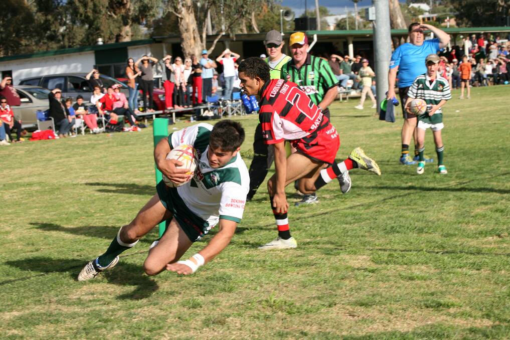 Dunedoo winger Tyson Searle goes in to score his second try during the Swans win on Saturday.  
Photo: Natalie Ghiggioli