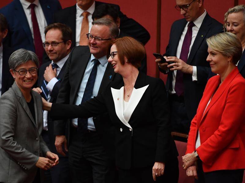 Anthony Albanese (2nd L) has remembered the night 10 years ago when Julia Gillard (C) became PM.