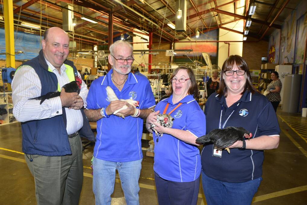 Christian Grieves, John Case, Libby Warrell and Jenni Stewart with some of the poultry to go under the auctioneer s hammer on Saturday.                         Photo: BELINDA SOOLE