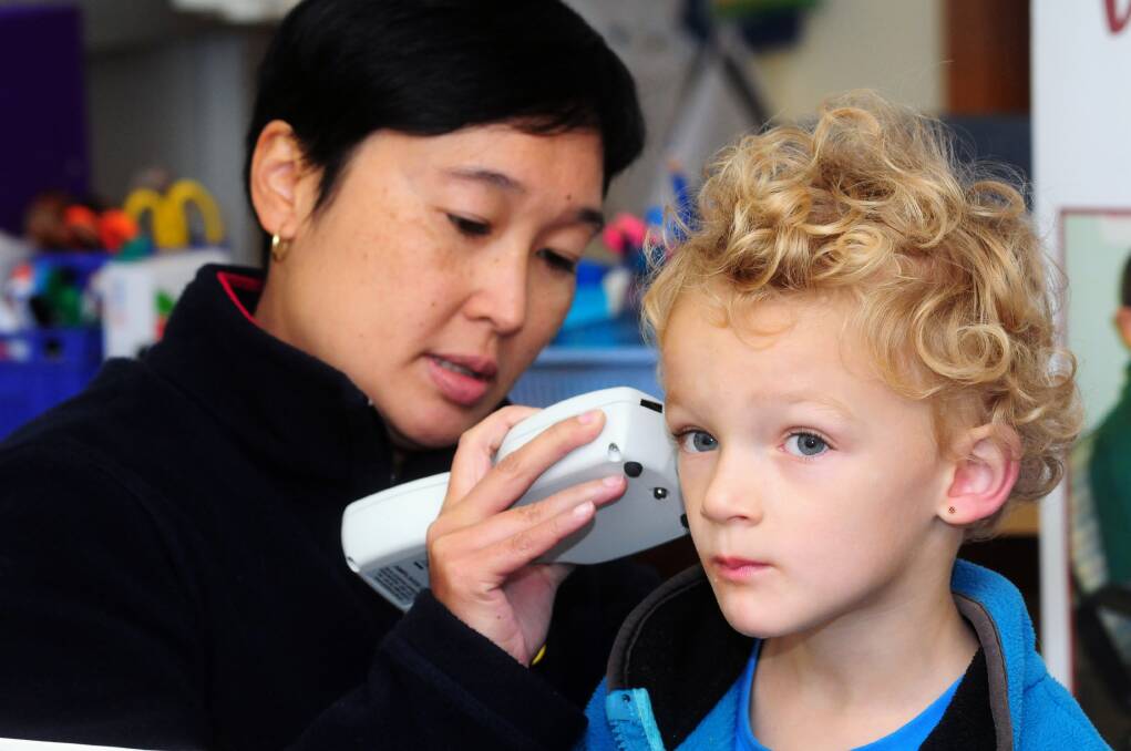 Audiologist Jocelyn Ho with Royal Institute for Deaf and Blind Children conducting a tympanometry, checking the health of the middle ear, on Nicholas Jones, a pre-school student at Dubbo West Public School.                                                      
 
Photo: LOUISE DONGES.