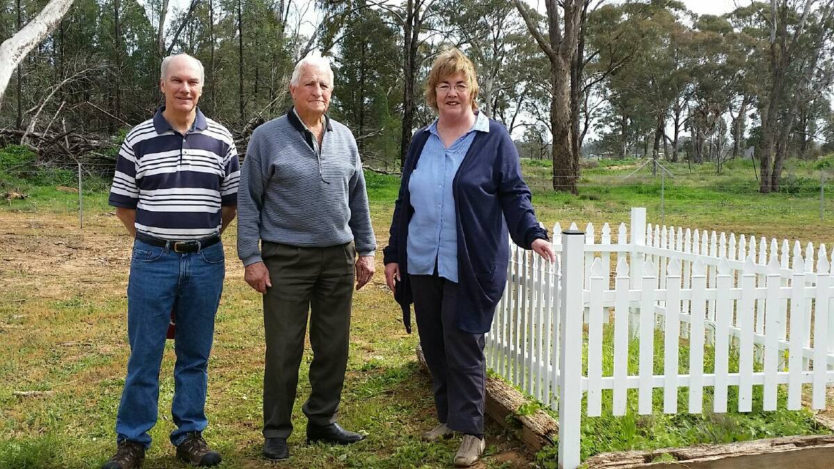 Dubbo City Council director community services David Dwyer, Eumungerie Progress Association's Les Brookfield and local historian Sandra Smith at Saturday's ceremony to mark the restoration of the Eumungerie Cemetery.