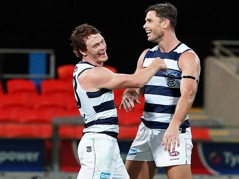 Gary Rohan and Tom Hawkins celebrate following a goal in Geelong's big AFL win over Port Adelaide.