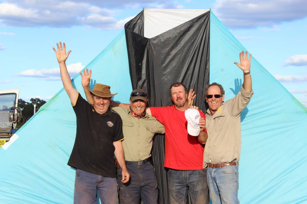 Bob Moore, Roger Martin, Michael Jenkins and Michael Richards with the kite they successfully flew to 16,000 feet, breaking a world record in the process.  
Photo: CONTRIBUTED