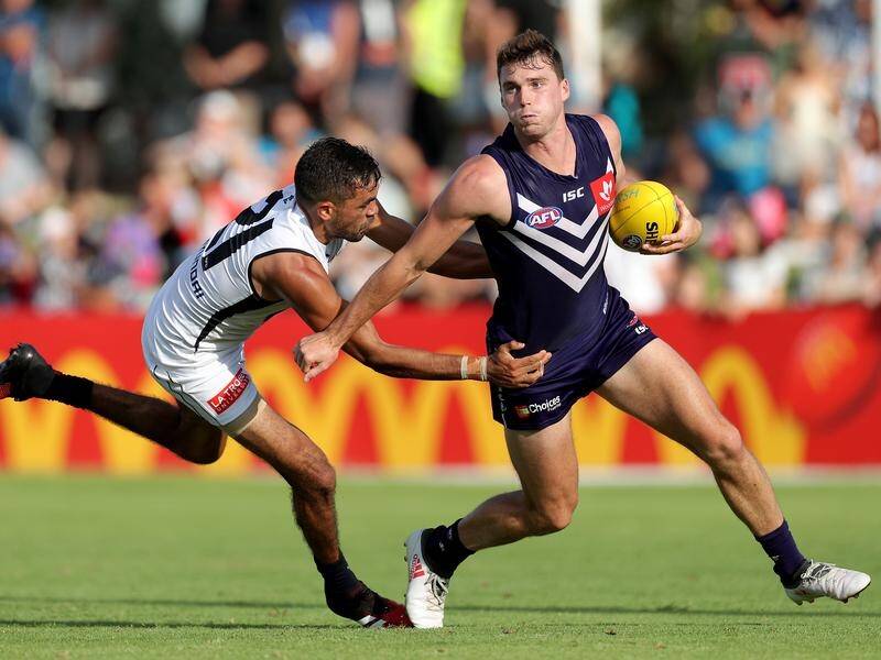 Blake Acres (r) shone for the Dockers in the AFL pre-season match against Carlton Blues.