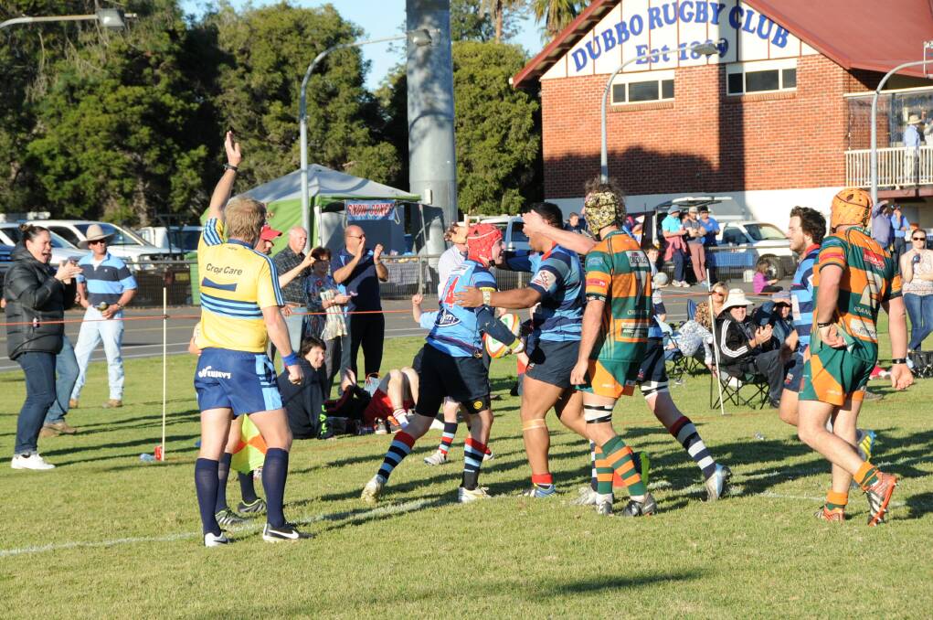 Dubbo players run to congratulate teenage winger Blake Sharpe after he scored what turned out to be the match winner on Saturday.  
Photo: Belinda Soole