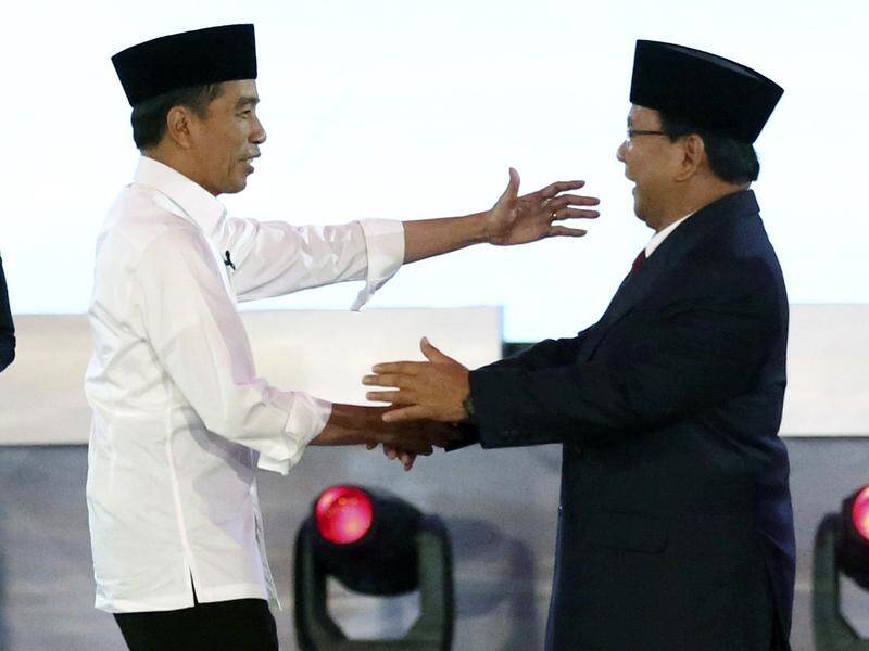 Indonesian President Joko Widodo, left, and his contender Prabowo Subianto after an election debate.