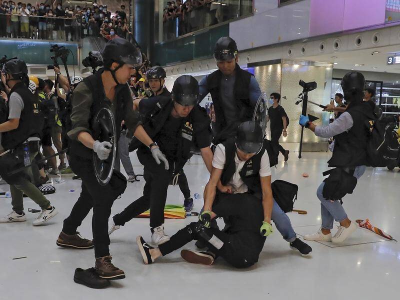 Police and protesters demanding the resignation of Hong Kong's CEO have clashed inside a mall.