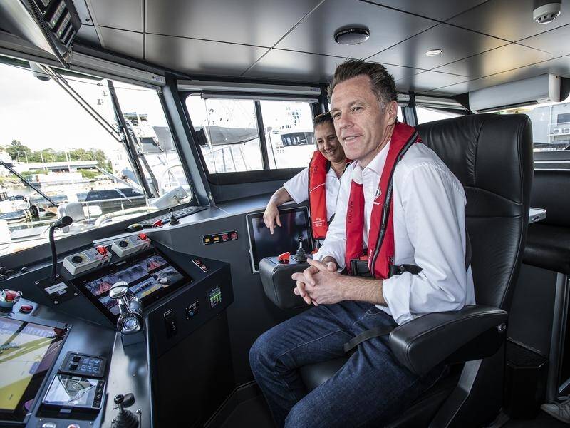 Premier Chris Minns briefly got to play ferry captain. (Steven Siewert/AAP PHOTOS)