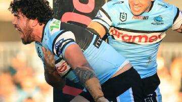 Braden Hamlin-Uele (l) rejected better offers to remain at Cronulla for another two seasons. (Mark Evans/AAP PHOTOS)