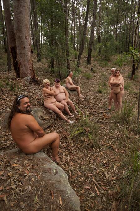 Kit comes off: Members of the Campbelltown Heritage Nudist Club take a nature walk au naturel on their property at Minto Heights. Photo: Wolter Peeters