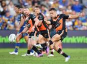 Luke Brooks faces competition for his spot in the Wests Tigers' halves with Adam Doueihi's return.