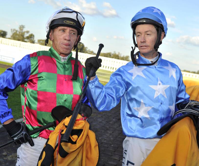 Jockey of Cardiff Prince, Mathew Cahill, and It's A Virtue, Kevin Sweeney, wait for a steward's decision on who won the Murrumbidgee Cup on Sunday. The pair couldn't be separated and it was declared a draw. Photo: LES SMITH