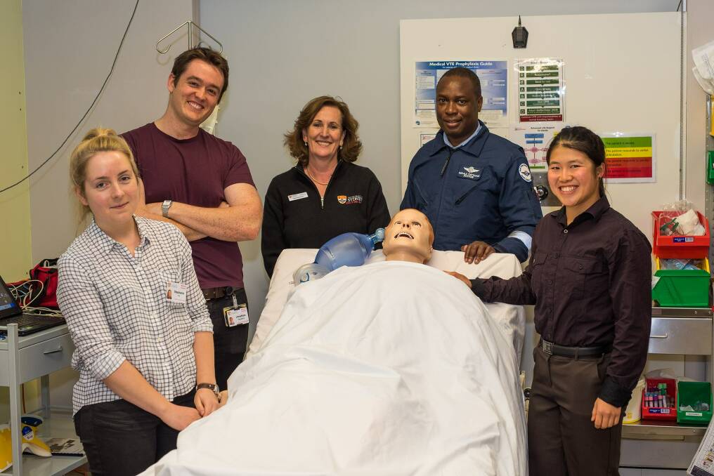 Dubbo's own medical school: Steph Pitt, Jonathan Sandeford, Gabrielle Arnold, Dr Gerald Chitsunge and Ruby Kwong with the manikin SimMan3G.  
Photo: CONTRIBUTED