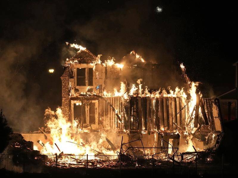Hundreds of homes burned in wildfires fanned by winds outside Denver in the US state of Colorado.