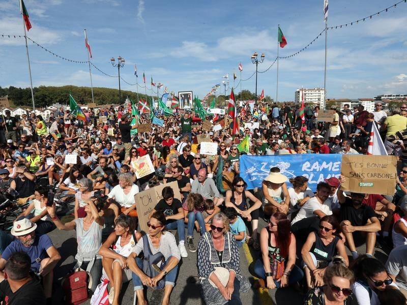 Huge protests have been held across France and in the British port of Dover over climate change.