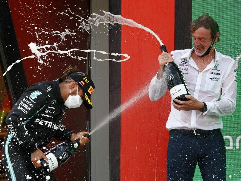 Sports fan Jim Ratcliffe, here celebrating a Lewis Hamilton F1 win, is bidding to buy Chelsea.