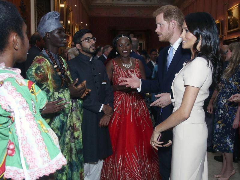Prince Harry and Meghan have chatted and joked with guests at the Queen's Young Leaders Awards.