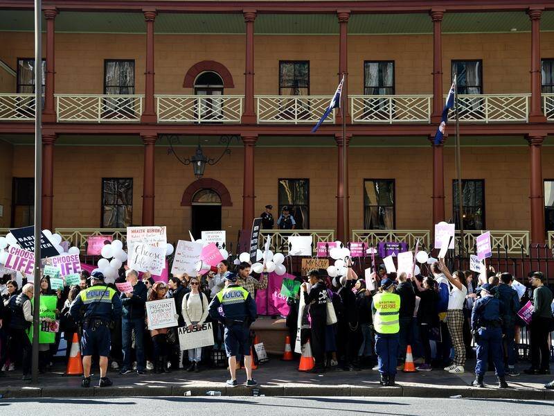 Anti-abortion and pro-choice advocates rallied outside NSW Parliament with debate underway inside.