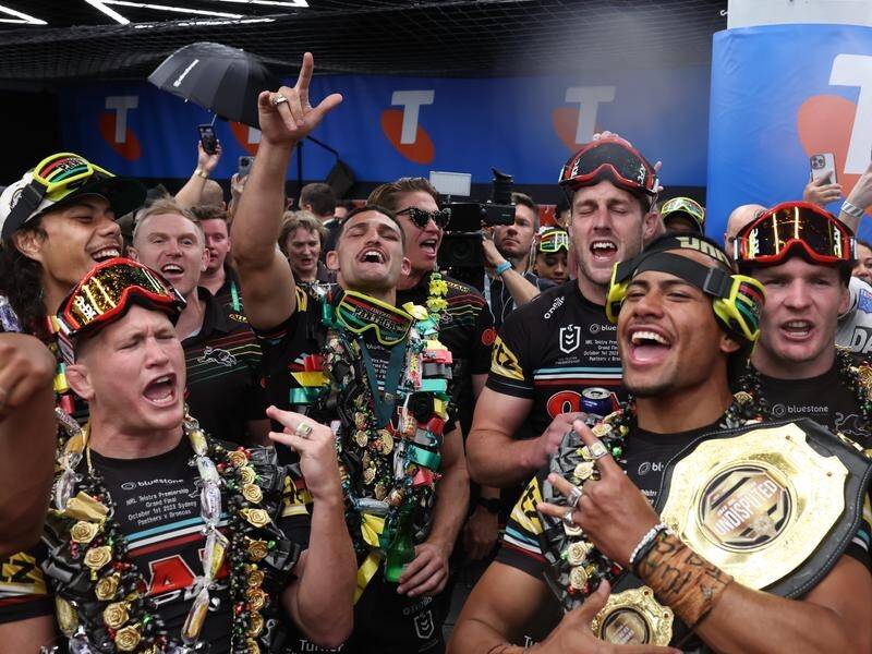 Stephen Crichton holds the Panthers' 'Undisputed' belt amid post-match celebrations on Sunday night. (Mark Evans/AAP PHOTOS)