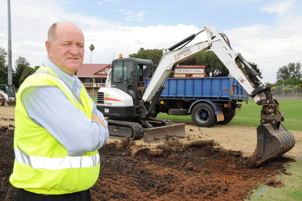 Dubbo City Council parks and landcare operations manager Mark Kelly at the site of the Victoria Park No. 1 Oval pitches that are being excavated and replaced.	Photo: BELINDA SOOLE