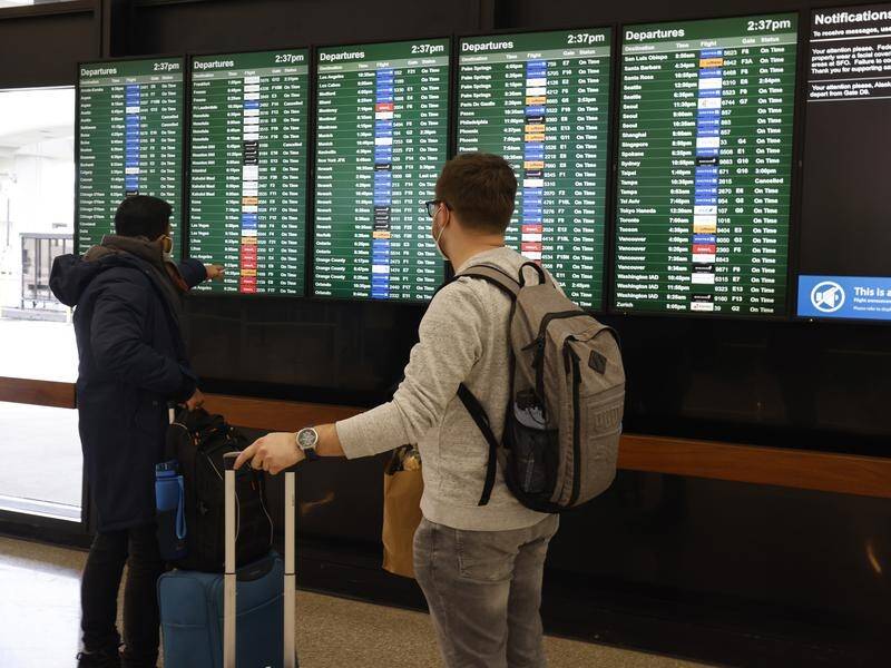 Travellers in the US are wrestling with multiple cancelled flights amid a surge of COVID-19 cases.