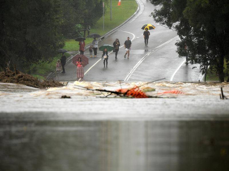 The body of a 68-year-old man has been retrieved from floodwaters southwest of Sydney.