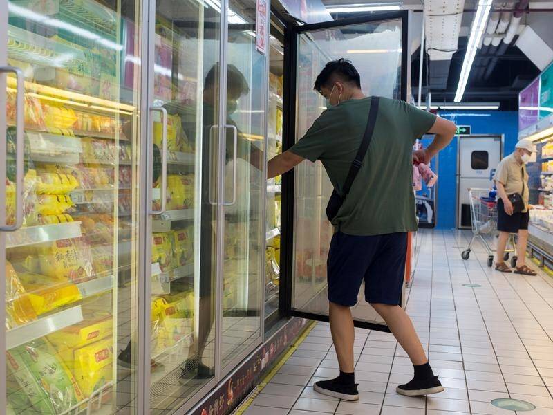 Chinese authorities say coronavirus traces have been found on frozen food packaging in two cities.