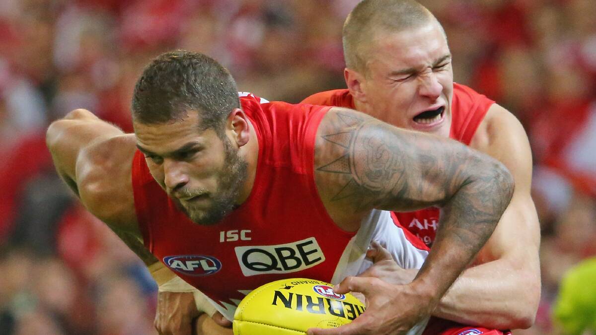 Lance Franklin of the Swans is tackled by Tom McDonald of the Demons. Picture: Getty Images.