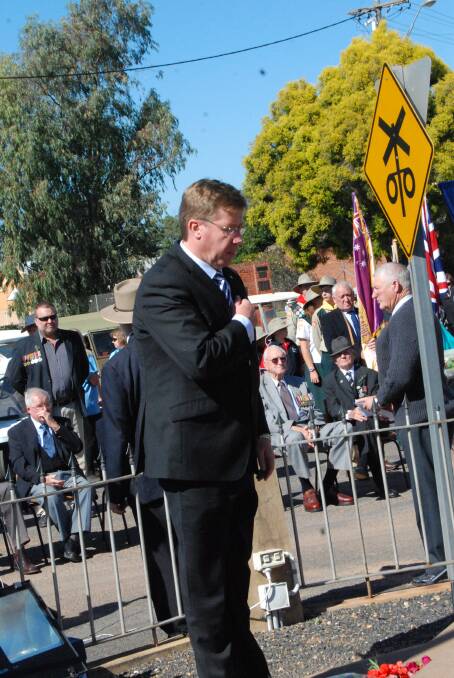 MORNING SERVICE: Troy Grant laying his wreath