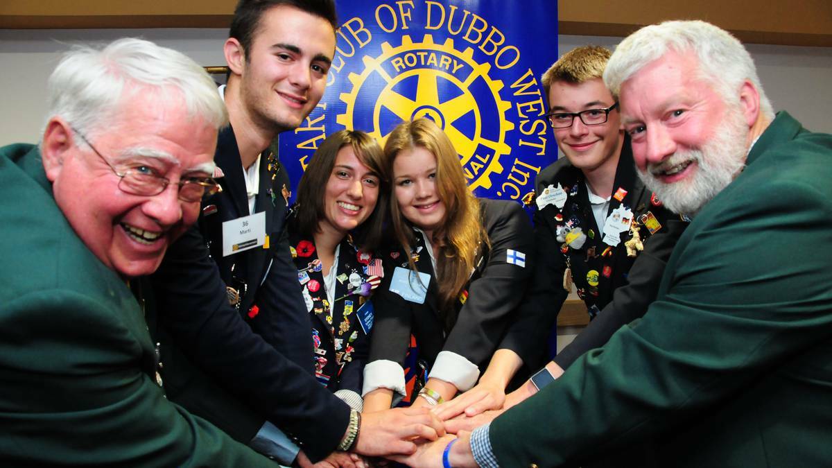 Rotary District 9670 Youth Exchange Program deputy chairman Geoff Smith, Marti Llorente, Sydney Fritch, Roosa-Olivia Kallio and Paul Orschau, and exchange program committee member Tim Manning share stories at Dubbo. File photo.