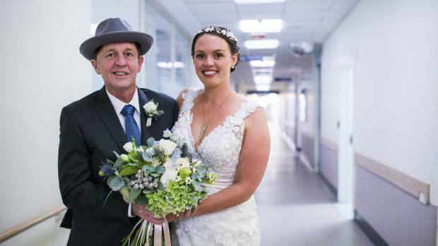Malcolm Gibson with his daughter Kate before her wedding at the Canberra Hospital. Photo: Rohan Thomson
