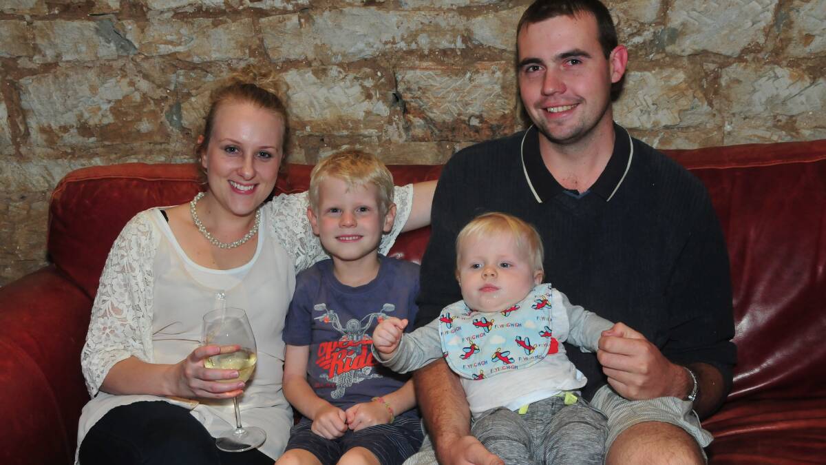 WELCOME HOME JOSH: Danielle, Cooper, Lachlan and Jason Hattenfels. Photo: HOLLY GRIFFITHS. 