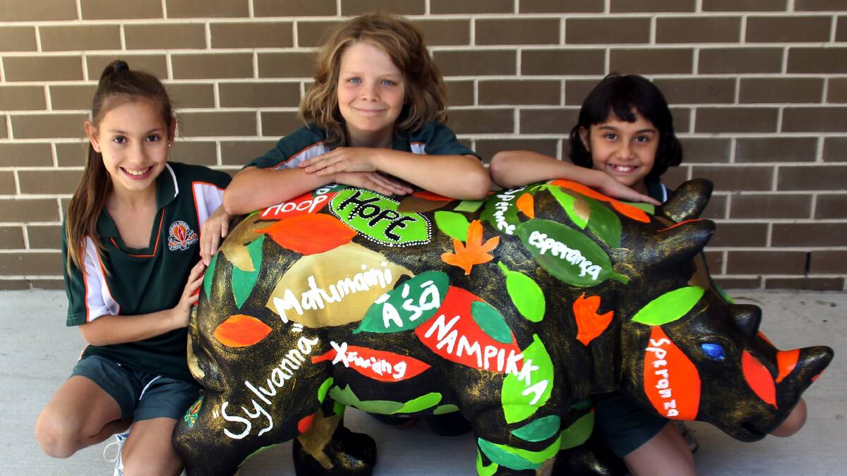 Zoe, James and Ashanti from Sylvania Public School design a rhino for animal funds.