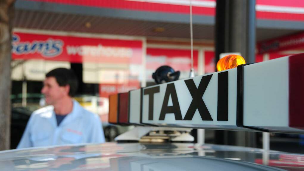 A Dubbo taxi driver on the Dubbo Shopping Square taxi rank in Macquarie Street. Photo: GREG KEEN