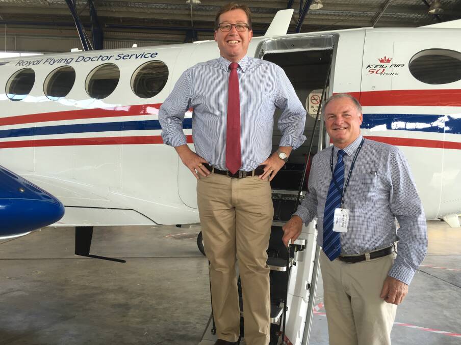 NSW Deputy Premier Troy Grant and Royal Flying Doctor Service Dubbo Support Group president Terry Clark are all smiles after the announcement of an $18 million investment in it. Photo: CONTRIBUTED