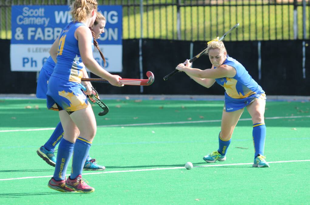 STRONGER FORM: Leanne Kennewell winds up for Ex-Services during the women's Premier League Hockey season. Photo: JUDE KEOGH 0411hockey4