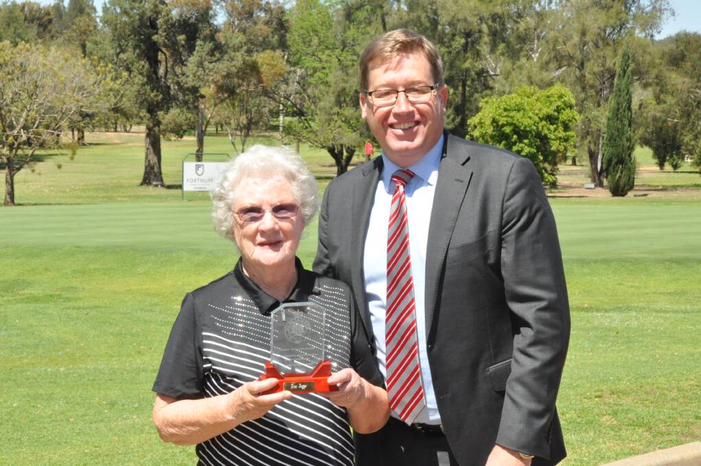 TERRIFIC: Volunteer Tina Beggs was presented with an Electorate Award from Dubbo MP Troy Grant for her dedication to the golfing community. Photo: CONTRIBUTED