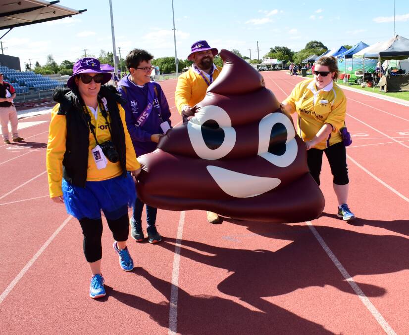 AWARENESS: Participants in the Orana Relay for Life pushed the inflatable poo around Barden Park for 17 hours to raise awareness. Photo: AMY McINTYRE