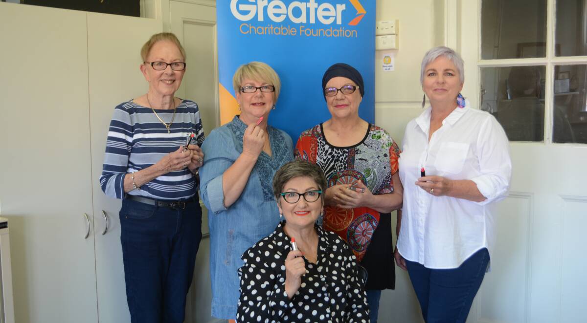 BIT OF LIPSTICK: Volunteers Marea Barnes, Carol Dickson, Rhonda Millar, Louise Griffith and Christine Horder at the Look Good Feel Better workshop ready to brighten things up. Photo: ORLANDER RUMING
