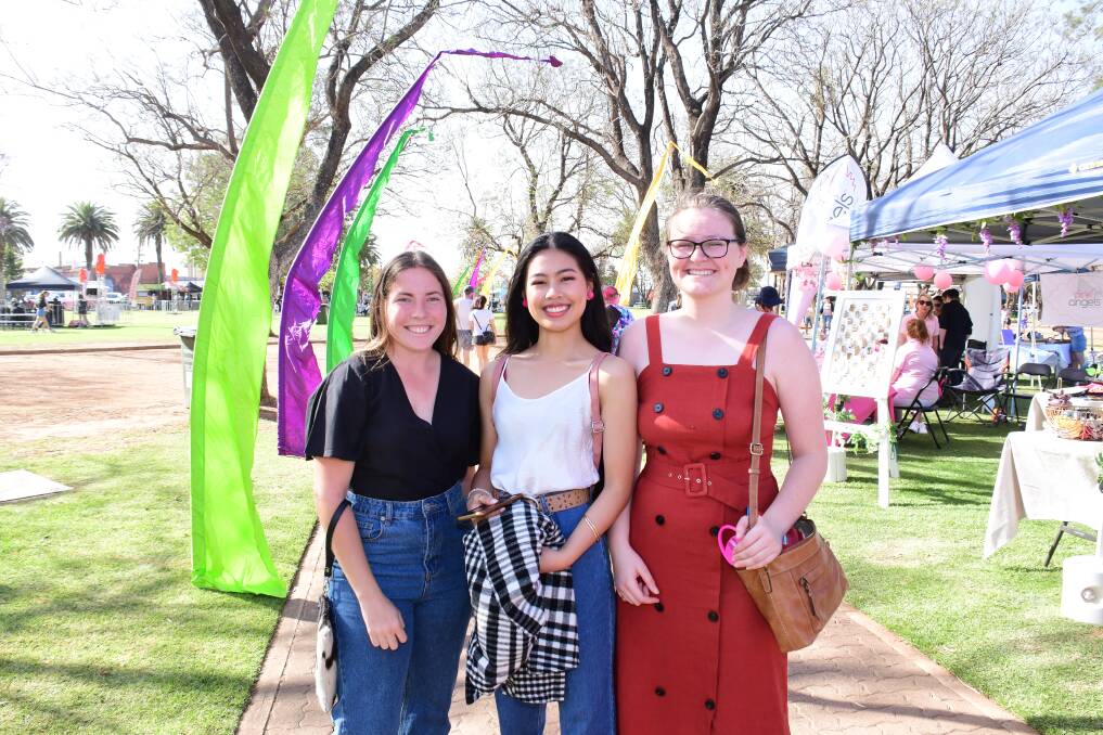 DRAWS A CROWD: Ashley Mitchell, Faith McKinney and Grace Skinner at last year's DREAM Festival markets in Victoria Park. Photo: AMY McINTYRE
