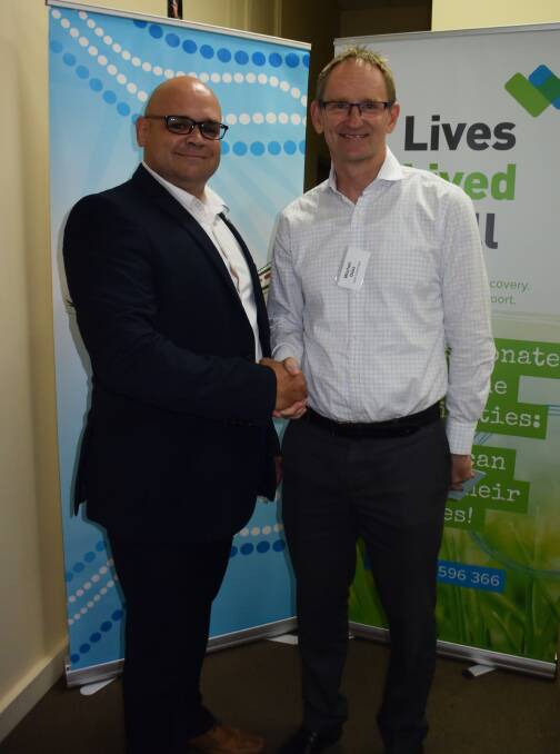 BETTER OUTCOMES: Bila Muuji Aboriginal Corporation Health Service CEO Phil Naden and Lives Lived Well CEO Mitchell Giles celebrating the partnership. Photo: ORLANDER RUMING