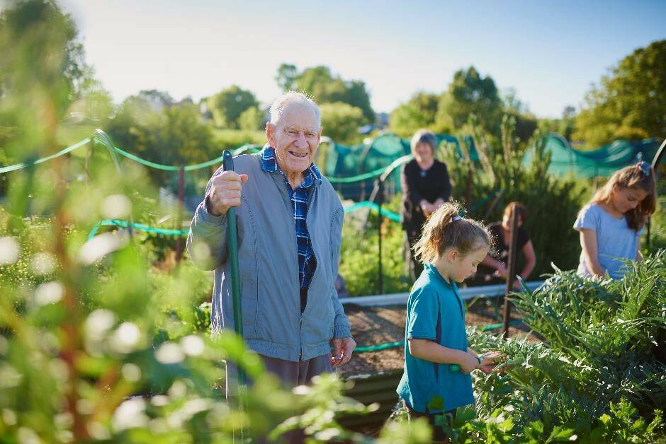 GREAT MAN: The late Roy Brooks will share his gardening tips on the new Yellow and White Pages, featured alongside his photograph on the cover at the OEC Community Garden. Photo: CONTRIBUTED