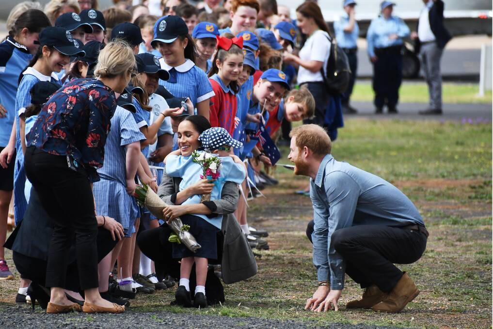 Luke Vincent, a student at Buninyong Primary School, hugs Meghan the Dutchess of Sussex at the Dubbo airport in 2018. Picture by Belinda Soole